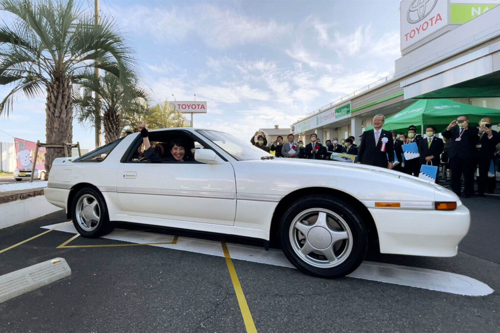 Then Minister Sanae Takaichi and her favorite car, a Toyota Supra