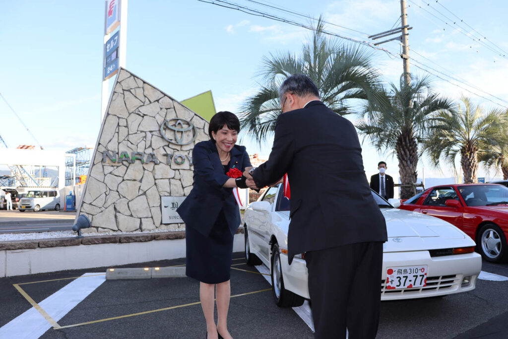 Then Minister Sanae Takaichi and her favorite car, a Toyota Supra