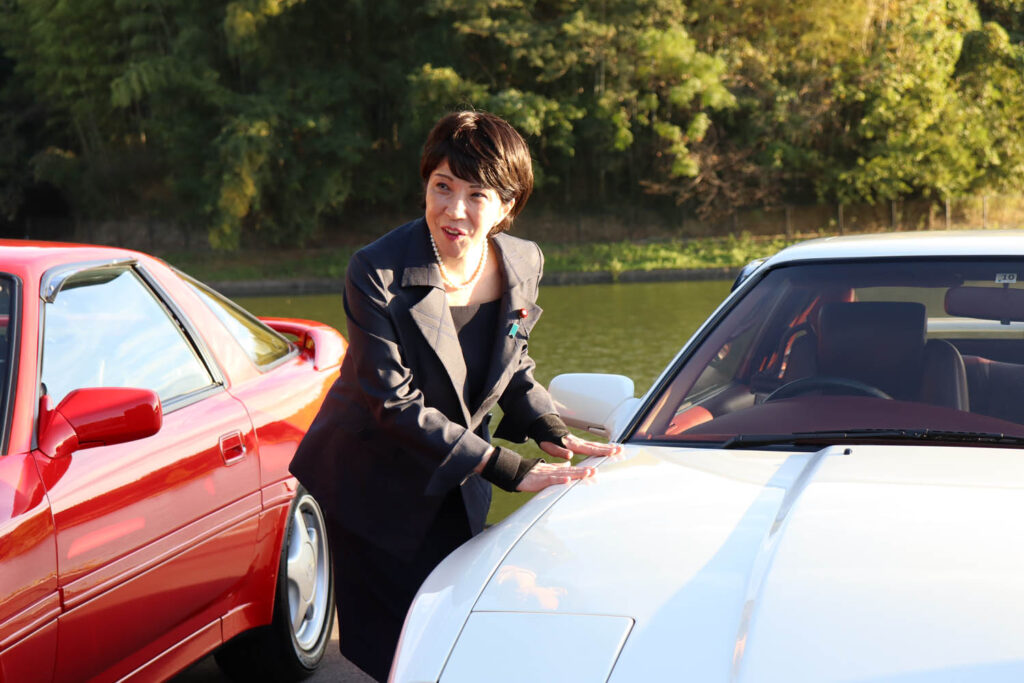 Then Minister Sanae Takaichi and her favorite car, a Toyota Supra