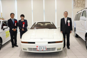 Then Minister Sanae Takaichi and her favorite car, a Toyota Supra