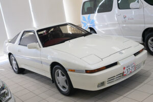 Then Minister Sanae Takaichi and her favorite car, a Toyota Supra