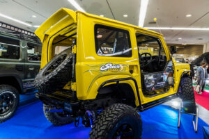 Current model Suzuki Jimny on display at the Showa Garage booth at Osaka Auto Messe 2024