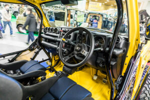 Current model Suzuki Jimny on display at the Showa Garage booth at Osaka Auto Messe 2024