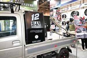 Suzuki Carry demo car on display at the Weds booth at Osaka Auto Messe 2024