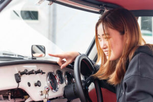 Ms. Rami Sasaki test drives a 1965 Toyota Sports 800